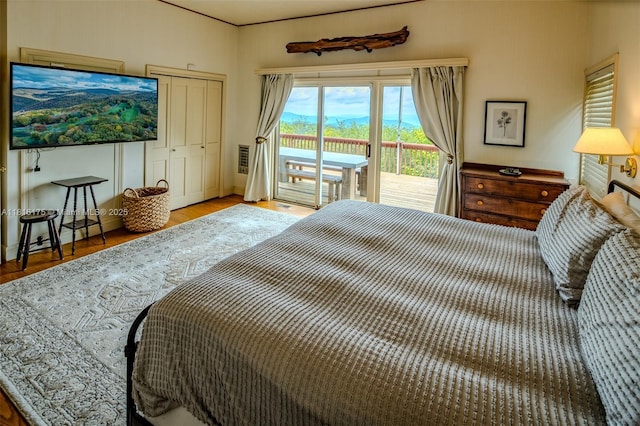 200 Summit Lodge Rd, Nc, NC 28604 - bedroom with access to outside, wood finished floors, and a closet