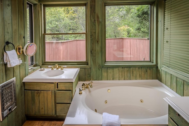 200 Summit Lodge Rd, Nc, NC 28604 - bathroom with heating unit, vanity, and a jetted tub