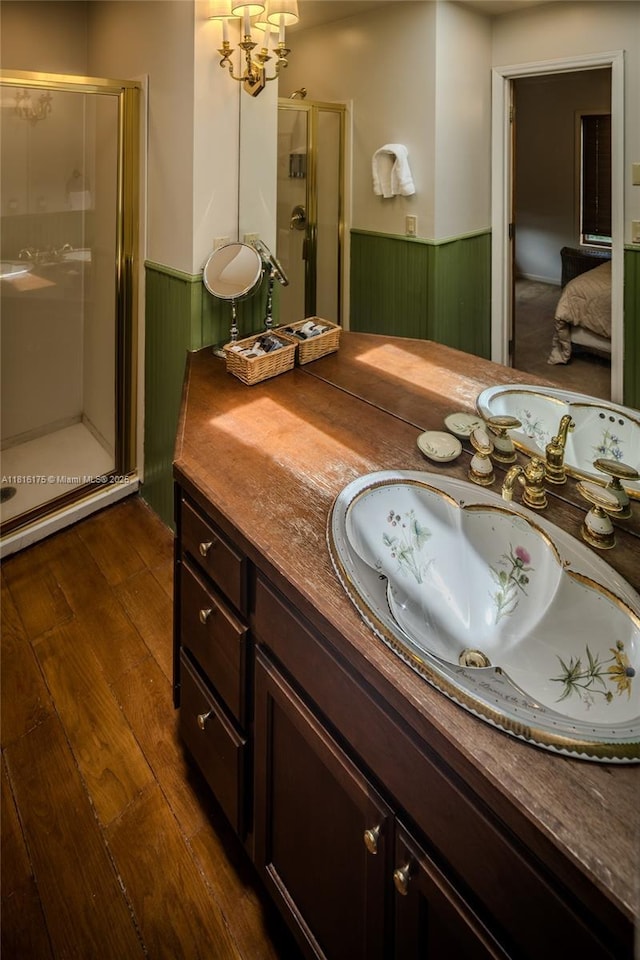 200 Summit Lodge Rd, Nc, NC 28604 - ensuite bathroom featuring wainscoting, a stall shower, vanity, wood finished floors, and a chandelier