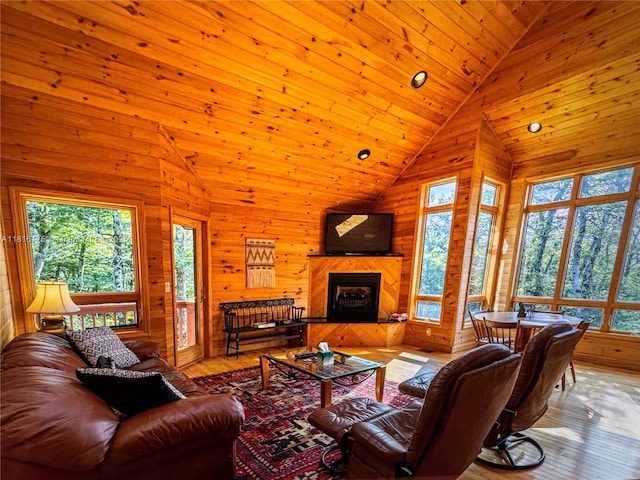 200 Summit Lodge Rd, Nc, NC 28604 - living room with hardwood / wood-style flooring, wooden walls, a fireplace, and high vaulted ceiling