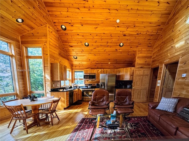 200 Summit Lodge Rd, Nc, NC 28604 - living area with healthy amount of natural light, wooden walls, light wood-style flooring, wood ceiling, and high vaulted ceiling