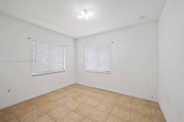 13557 SW 287th Ln, Homestead, FL 33033 - unfurnished room with light tile patterned flooring and a smoke detector