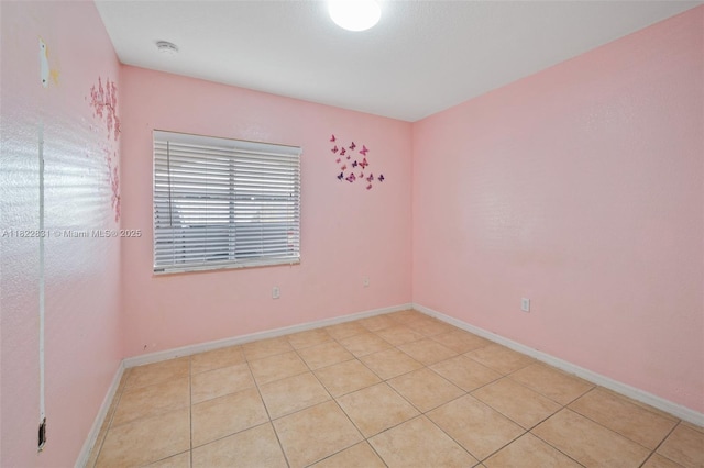 13557 SW 287th Ln, Homestead, FL 33033 - spare room featuring light tile patterned floors