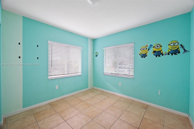 13557 SW 287th Ln, Homestead, FL 33033 - spare room featuring light tile patterned floors