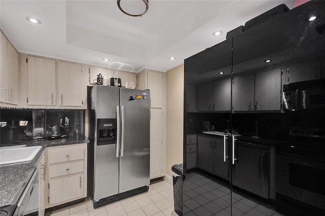 20225 NE 34th Ct Unit 1014, Aventura, FL 33180 - kitchen with stainless steel fridge, range with electric stovetop, black microwave, cream cabinets, and light tile patterned floors