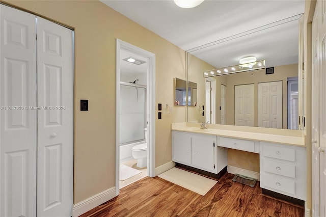 20225 NE 34th Ct Unit 1014, Aventura, FL 33180 - full bath with a closet, vanity, wood finished floors, and combined bath / shower with glass door