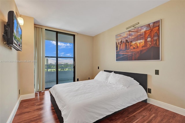20225 NE 34th Ct Unit 1014, Aventura, FL 33180 - bedroom with access to exterior, wood finished floors, and expansive windows