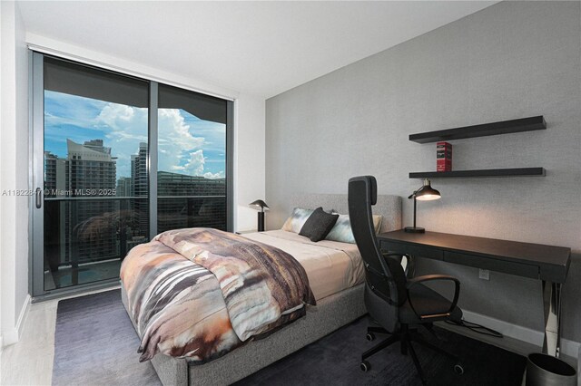 45 SW 9th St Unit 3403, Miami, FL 33130 - bedroom featuring an office area, access to outside, a city view, and a wall of windows