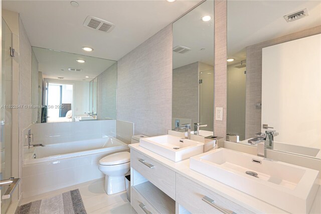 45 SW 9th St Unit 3403, Miami, FL 33130 - bathroom with a bath, tile patterned flooring, a shower stall, double vanity, and recessed lighting