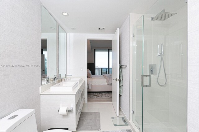45 SW 9th St Unit 3403, Miami, FL 33130 - ensuite bathroom featuring a shower stall, vanity, and tile patterned flooring