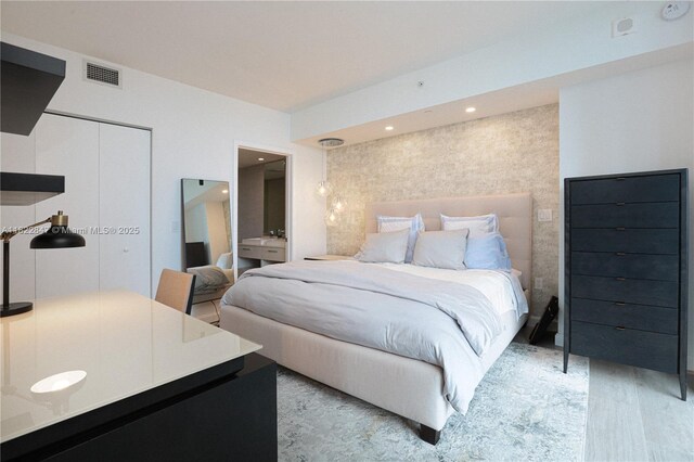 45 SW 9th St Unit 3403, Miami, FL 33130 - bedroom with light wood-style floors, a closet, and recessed lighting
