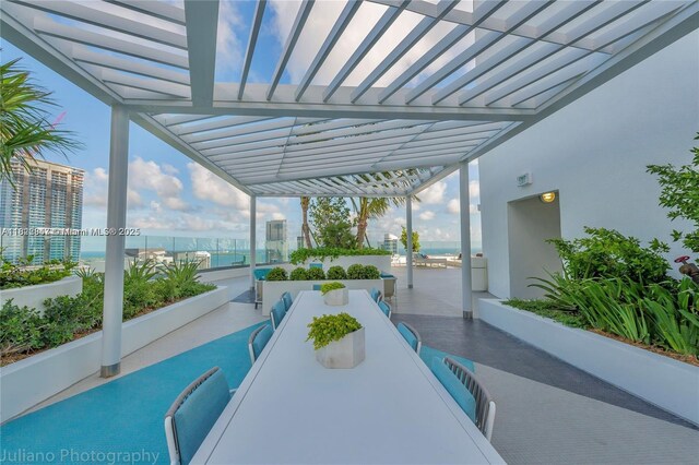 45 SW 9th St Unit 3403, Miami, FL 33130 - view of patio / terrace with a water view, outdoor dining space, and a pergola