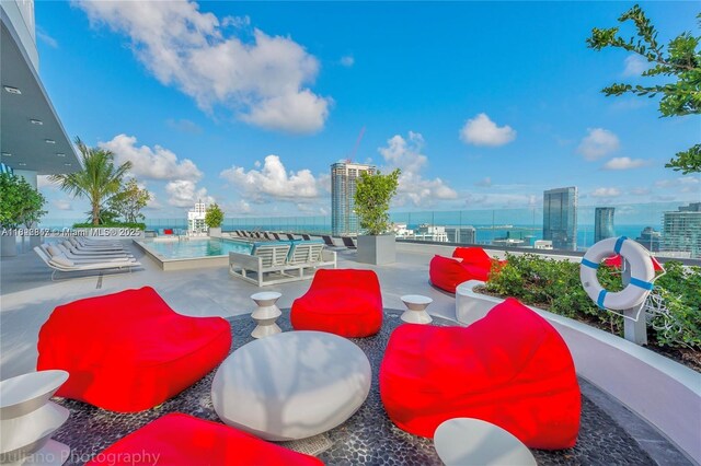 45 SW 9th St Unit 3403, Miami, FL 33130 - view of patio featuring a community pool and a city view