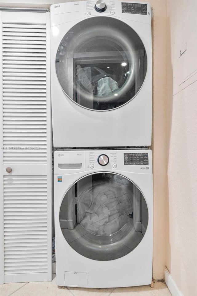 3032 Coral Ridge Dr Unit 217C, Coral Springs, FL 33065 - washroom with stacked washer / dryer