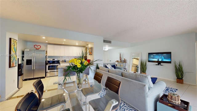 11111 Biscayne Blvd Unit 2G, Miami, FL 33181 - dining area with light tile patterned floors, recessed lighting, and a textured ceiling