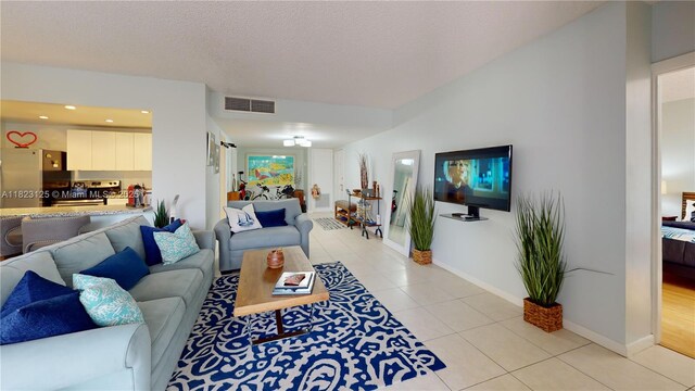 11111 Biscayne Blvd Unit 2G, Miami, FL 33181 - living area featuring light tile patterned floors, recessed lighting, and a textured ceiling