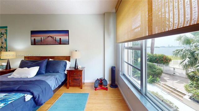 11111 Biscayne Blvd Unit 2G, Miami, FL 33181 - bedroom with wood finished floors and a water view