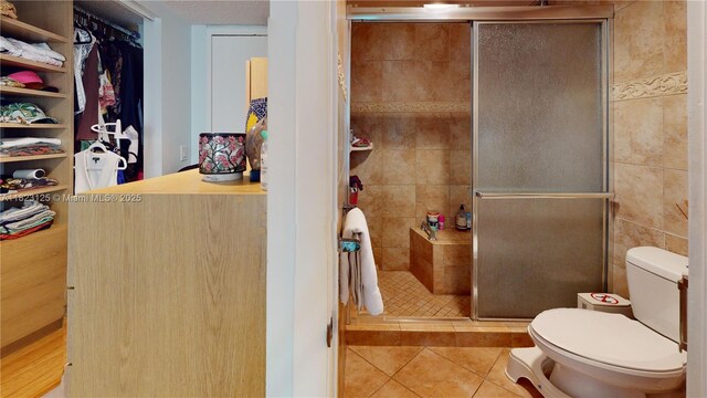 11111 Biscayne Blvd Unit 2G, Miami, FL 33181 - bathroom featuring tile patterned floors and a stall shower