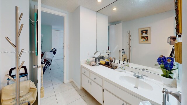 11111 Biscayne Blvd Unit 2G, Miami, FL 33181 - bathroom with tile patterned flooring, vanity, and recessed lighting