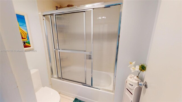 11111 Biscayne Blvd Unit 2G, Miami, FL 33181 - bathroom featuring bath / shower combo with glass door and toilet