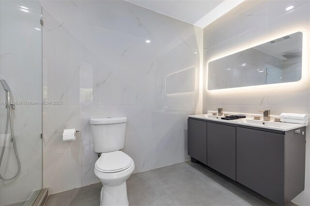 10361 SW 119th St, Miami, FL 33176 - bathroom featuring double vanity, tile walls, a marble finish shower, and concrete floors