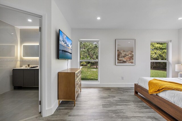 10361 SW 119th St, Miami, FL 33176 - bedroom featuring multiple windows, wood finished floors, ensuite bath, and recessed lighting