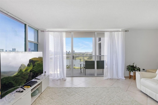 3731 N Country Club Dr Unit 2023, Aventura, FL 33180 - tiled living area with expansive windows and a water view