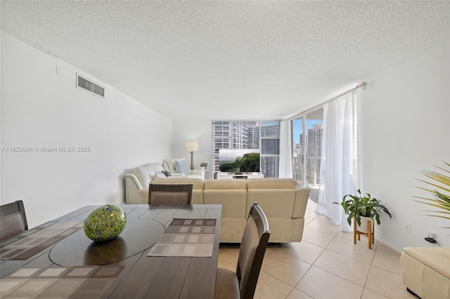 3731 N Country Club Dr Unit 2023, Aventura, FL 33180 - dining area with light tile patterned floors and a textured ceiling