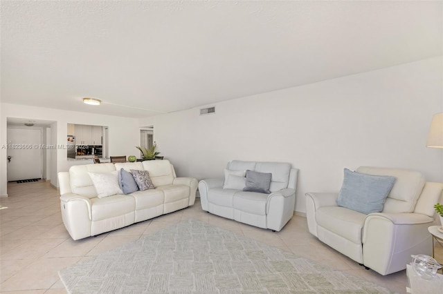 3731 N Country Club Dr Unit 2023, Aventura, FL 33180 - living room with light tile patterned floors and baseboards