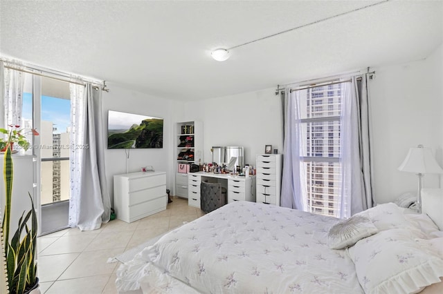 3731 N Country Club Dr Unit 2023, Aventura, FL 33180 - bedroom featuring light tile patterned floors and access to outside