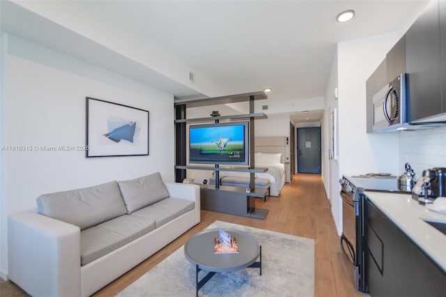 398 NE 5th St Unit 2407, Miami, FL 33132 - living room with light wood-style floors and recessed lighting