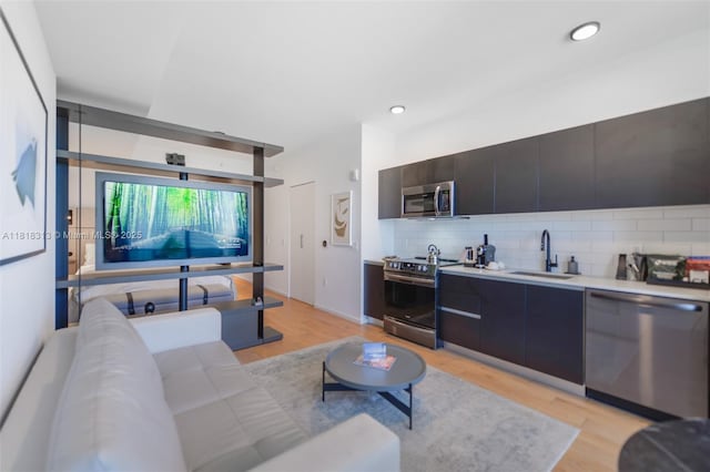 398 NE 5th St Unit 2407, Miami, FL 33132 - living room featuring light wood finished floors and recessed lighting