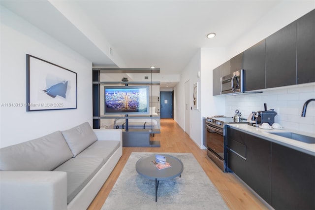 398 NE 5th St Unit 2407, Miami, FL 33132 - living area featuring light wood-type flooring