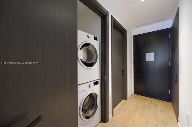 398 NE 5th St Unit 2407, Miami, FL 33132 - laundry area with stacked washer / dryer and light wood-style floors