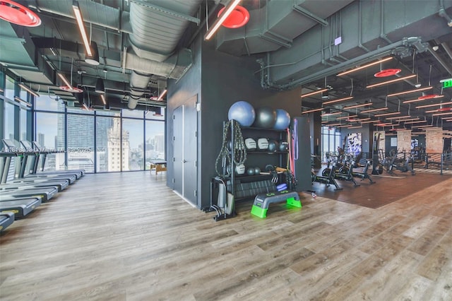 398 NE 5th St Unit 2407, Miami, FL 33132 - workout area featuring wood finished floors