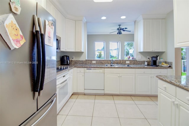 21025 NE 31st Ave, Aventura, FL 33180 - kitchen with appliances with stainless steel finishes, healthy amount of natural light, recessed lighting, ceiling fan, and white cabinets