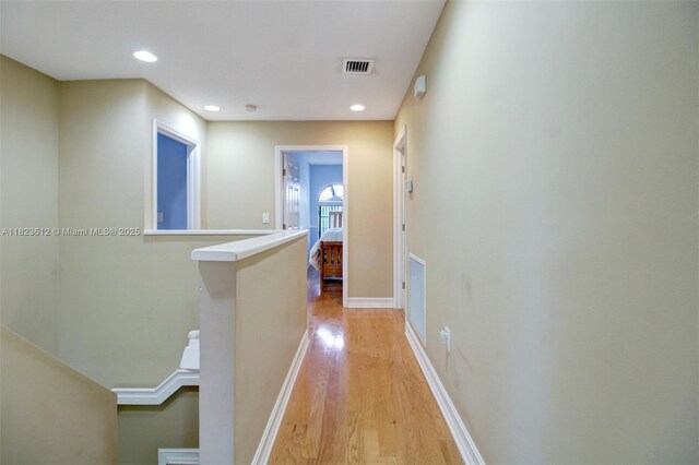 21025 NE 31st Ave, Aventura, FL 33180 - hall with an upstairs landing, light wood finished floors, and recessed lighting