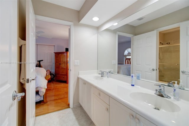 21025 NE 31st Ave, Aventura, FL 33180 - ensuite bathroom with double vanity, tile patterned flooring, recessed lighting, and a shower