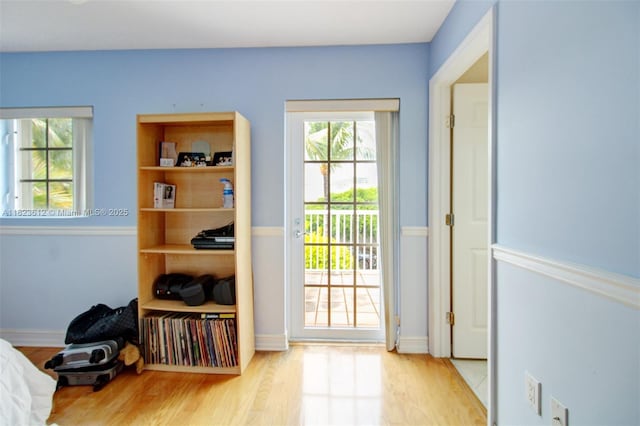 21025 NE 31st Ave, Aventura, FL 33180 - doorway with wood finished floors and baseboards
