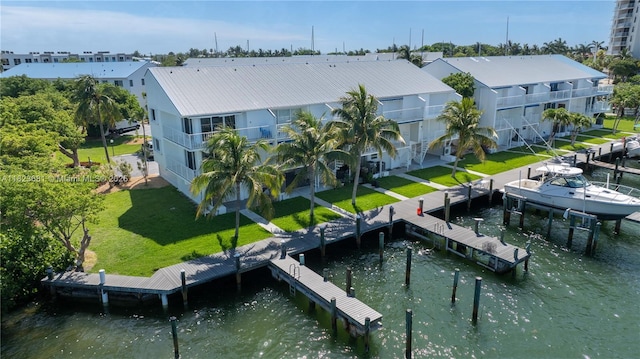 95 Coco Plum Dr Unit 1A, Marathon, FL 33050 - dock area with a lawn and a water view