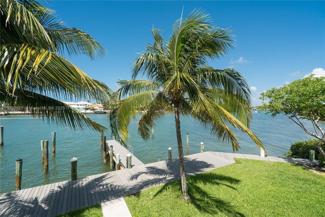95 Coco Plum Dr Unit 1A, Marathon, FL 33050 - dock area with a water view and a lawn