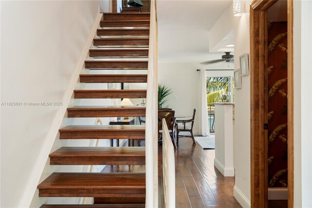 95 Coco Plum Dr Unit 1A, Marathon, FL 33050 - stairs featuring a ceiling fan and hardwood / wood-style floors