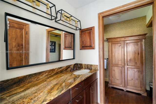95 Coco Plum Dr Unit 1A, Marathon, FL 33050 - bathroom with vanity, wood finished floors, and wallpapered walls