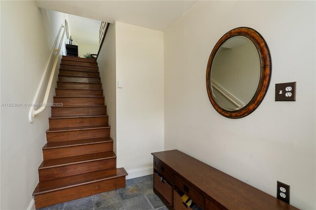 95 Coco Plum Dr Unit 1A, Marathon, FL 33050 - stairs featuring stone finish floors and baseboards