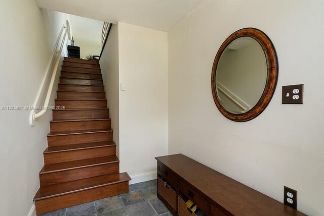 95 Coco Plum Dr Unit 1A, Marathon, FL 33050 - staircase with stone finish flooring and baseboards