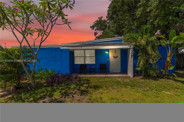 117 Ronald Rd, West Park, FL 33023 - view of front of home featuring a lawn, stucco siding, and a porch
