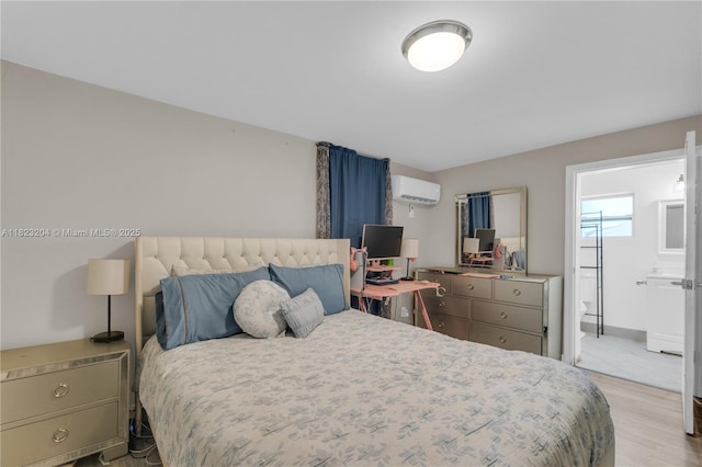 117 Ronald Rd, West Park, FL 33023 - bedroom featuring a wall mounted AC, wood finished floors, and ensuite bathroom