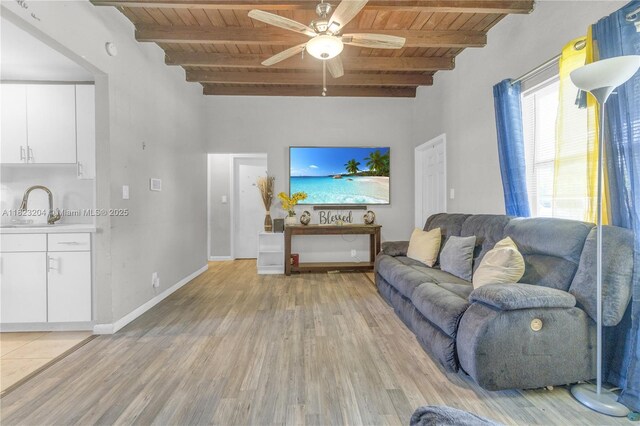 117 Ronald Rd, West Park, FL 33023 - living room featuring a wood ceiling with exposed beams, light wood-type flooring, and a ceiling fan