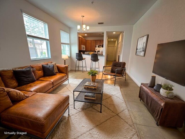 14745 SW 9th St Unit 3109, Pembroke Pines, FL 33027 - living area featuring a chandelier and light tile patterned floors