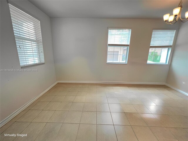 14745 SW 9th St Unit 3109, Pembroke Pines, FL 33027 - spare room with a chandelier and light tile patterned floors